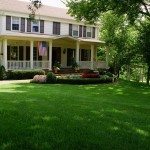 Green lawn by all-American house